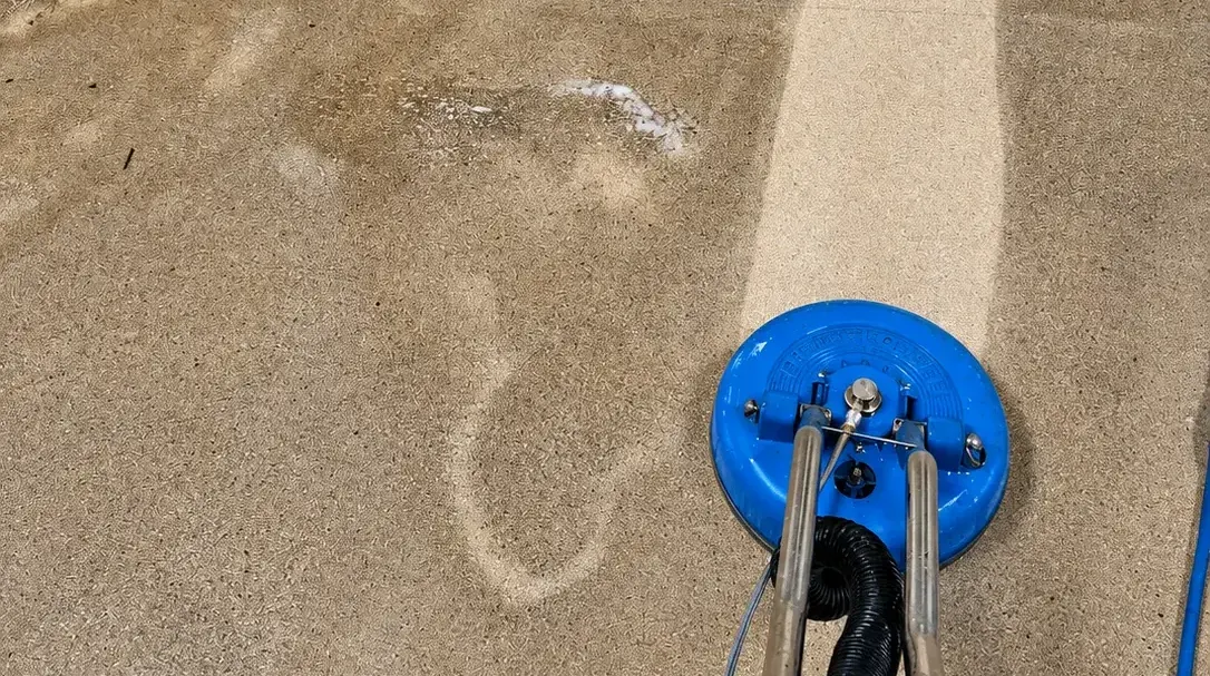 4 Elements technician using a rotary surface cleaner at a job site